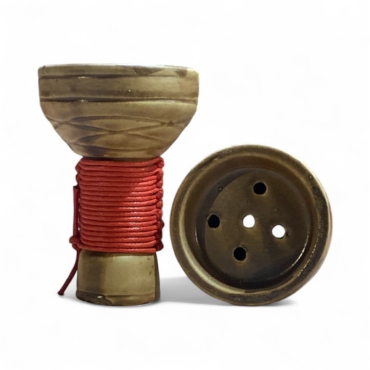 Pottery head with red thread